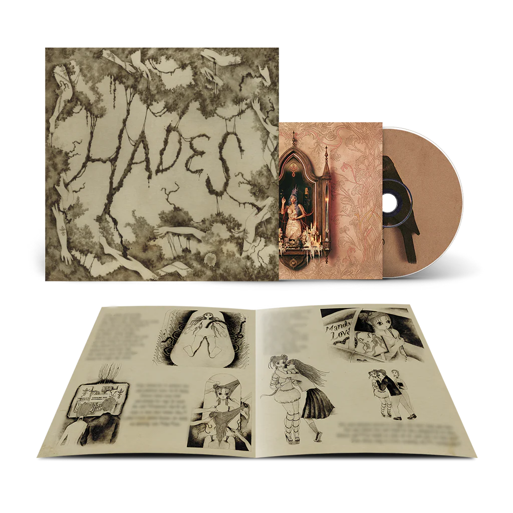 Imagen del CD de Melanie Martinez HADES con libro de historias, en la portada se muestra arte del álbum y el disco en primer plano.